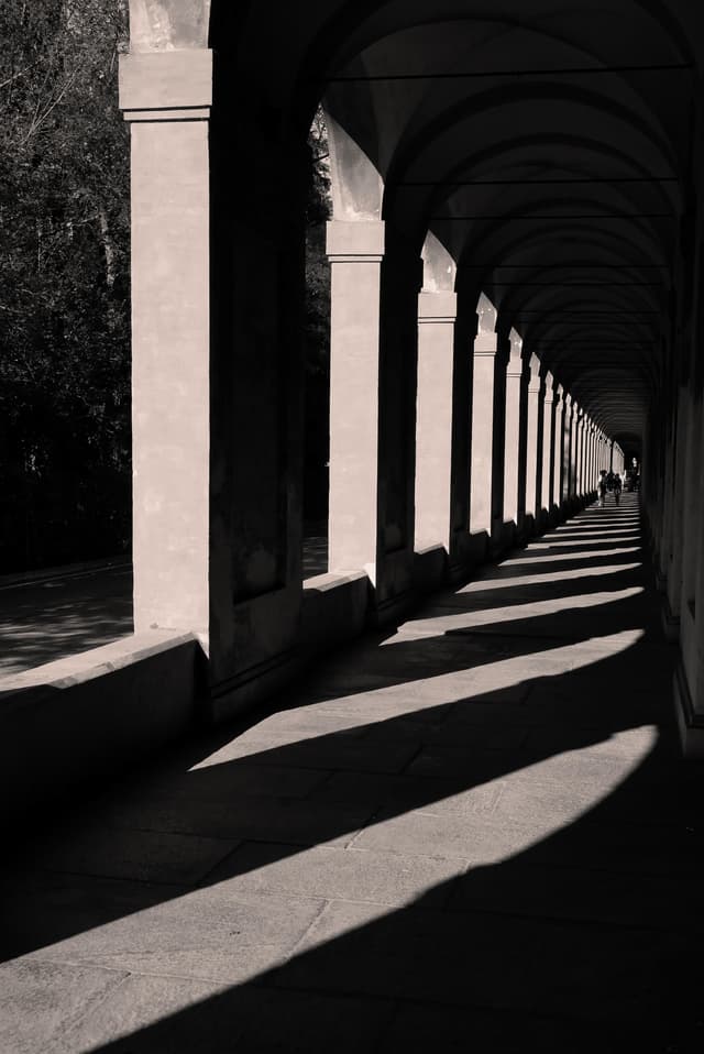 Light and shadow along an arched colonnade